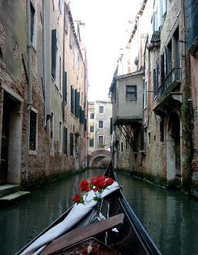 Pictured ... cruising down a "side" canal ... is a gondolier's or passenger's view from the gondola.  Just a peek off the main thoroughfares (or canals) of Venice.